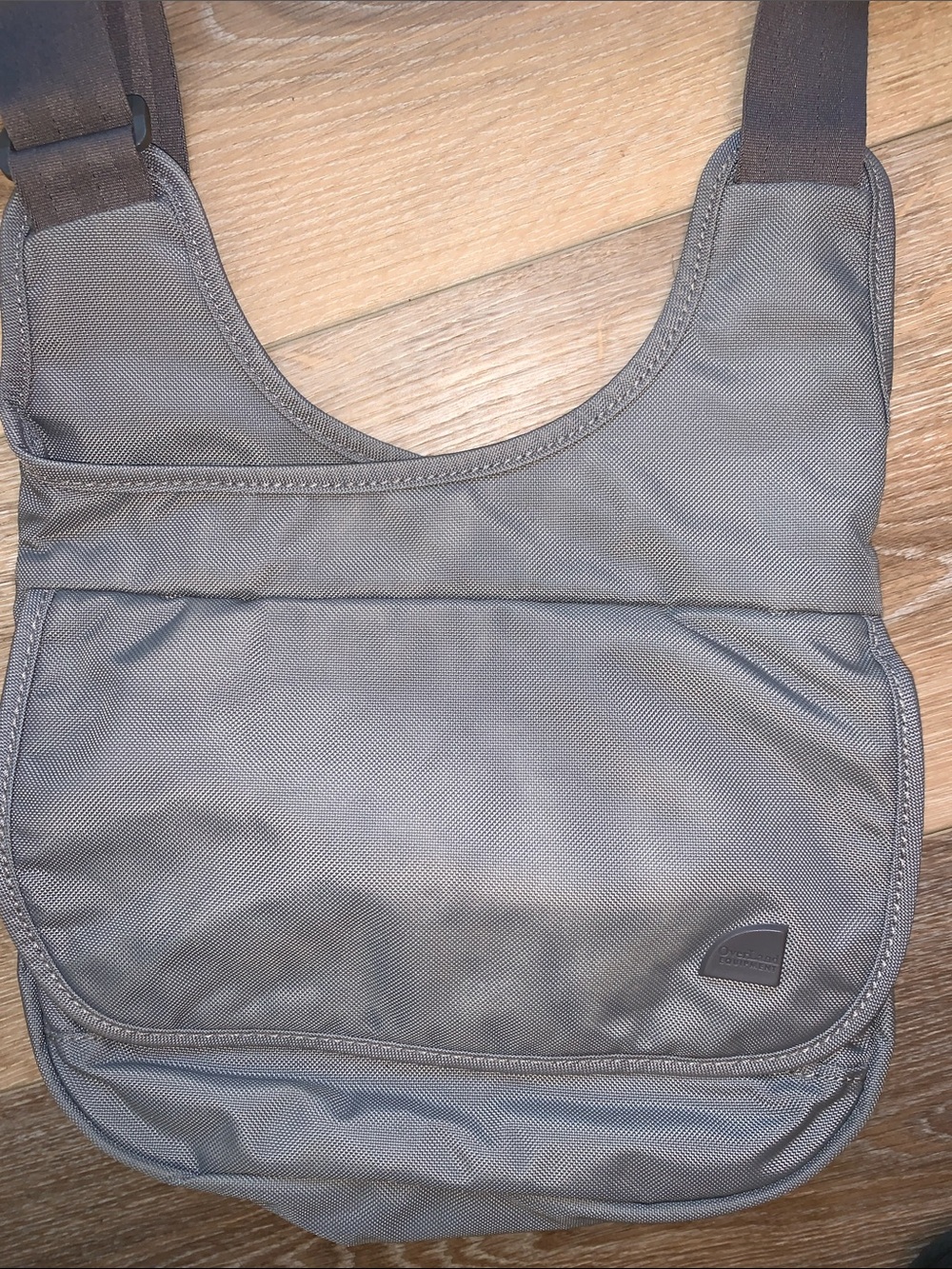 Overland equipment, sturdy nylon Crossbody, lots of compartments seatbelt strap